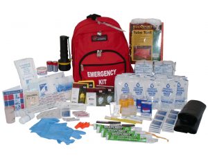 A kit would tent to include suitable food and water, emergency shelter, knives, ropes, candles, first aid kids, cooking supplies, and tools.